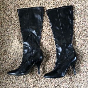 Tall black dress boots with 3 inch heel.